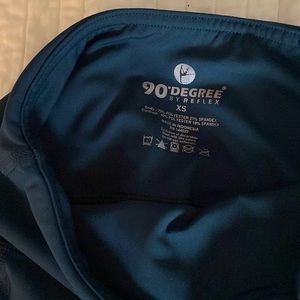 Pair of XS small leggings in teal-ish color